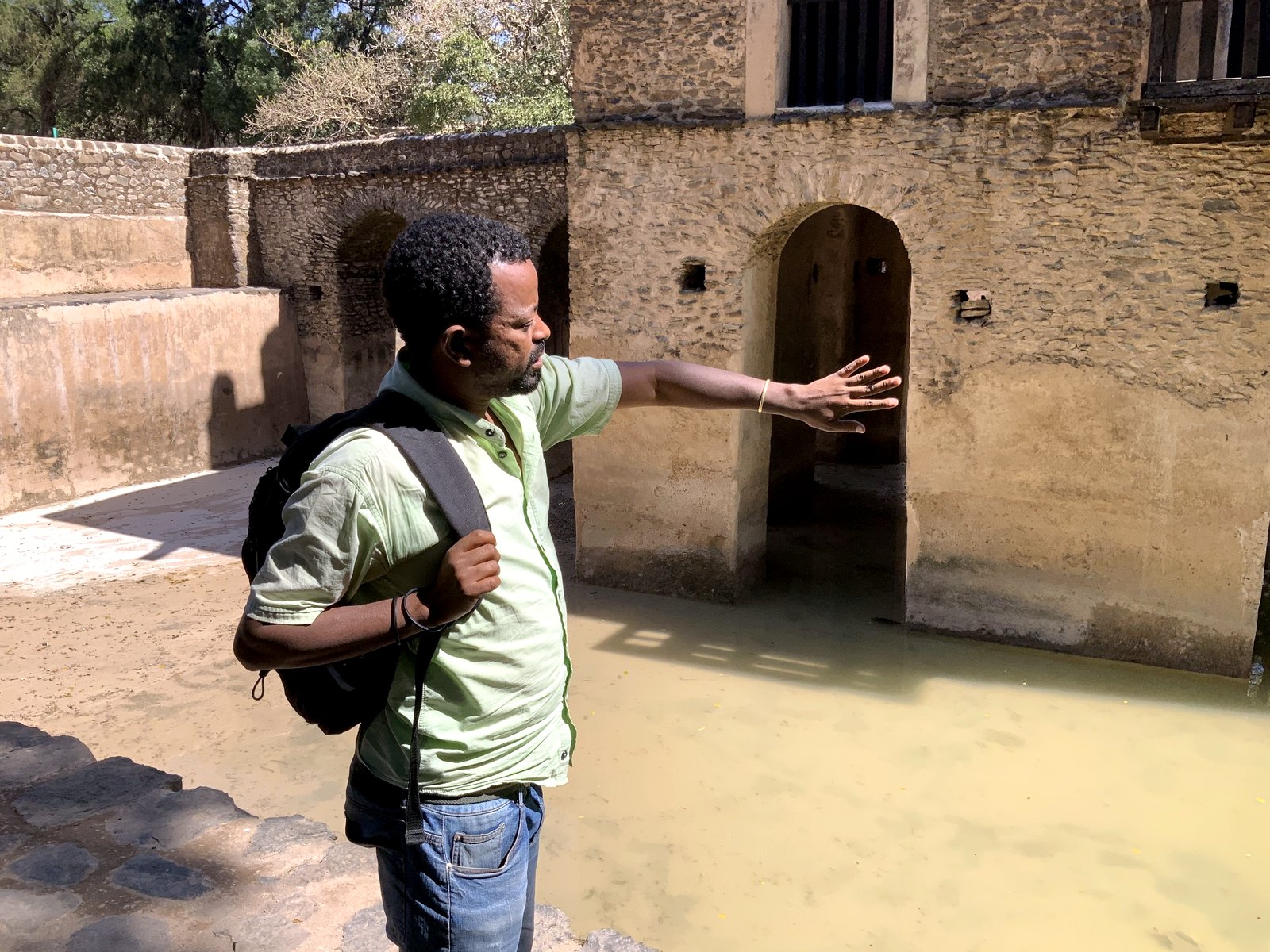 Local guide explaining a heritage site while planning a route.